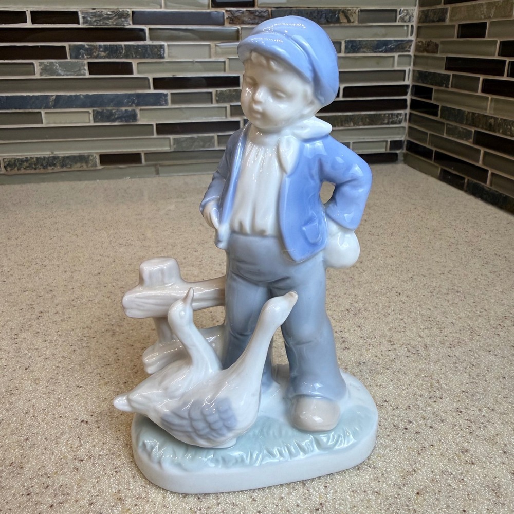 Vintage Porcelain Boy with Geese Figurine Blue & White Glossy Glaze 6" Art Deco